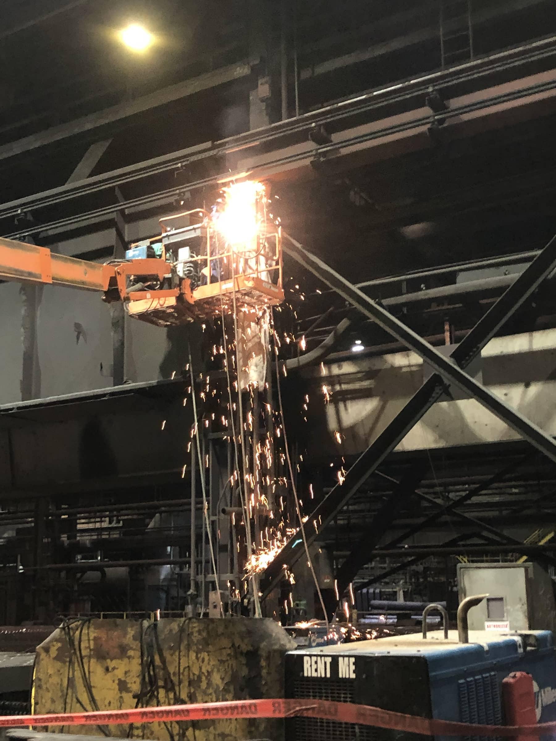 Night torch work from a boom lift during an outage